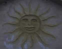 The office has this lovely sun sculpted in the lime over the main entrance.